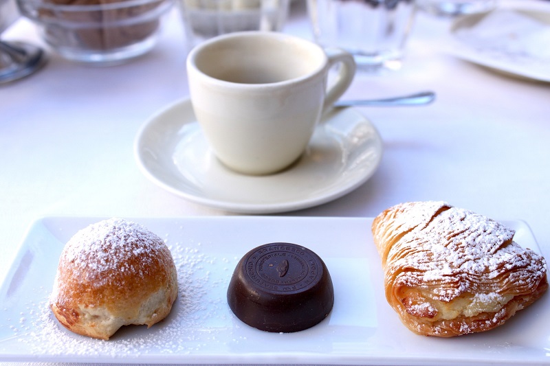 Typical Neapolitan sfogliatella Table with coffee and cakes